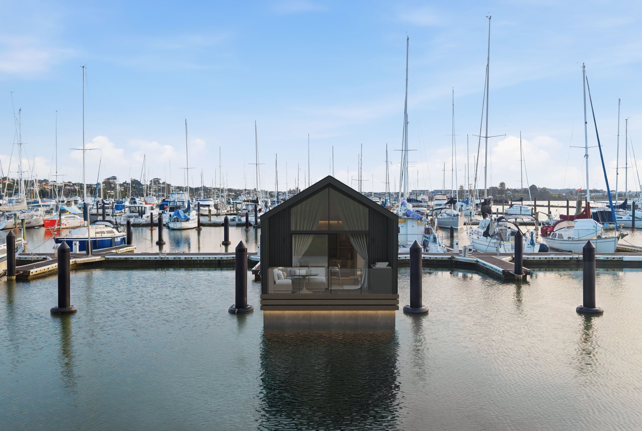 Aerial front render of a Boathouse Residence framed by marina boats and pontoons