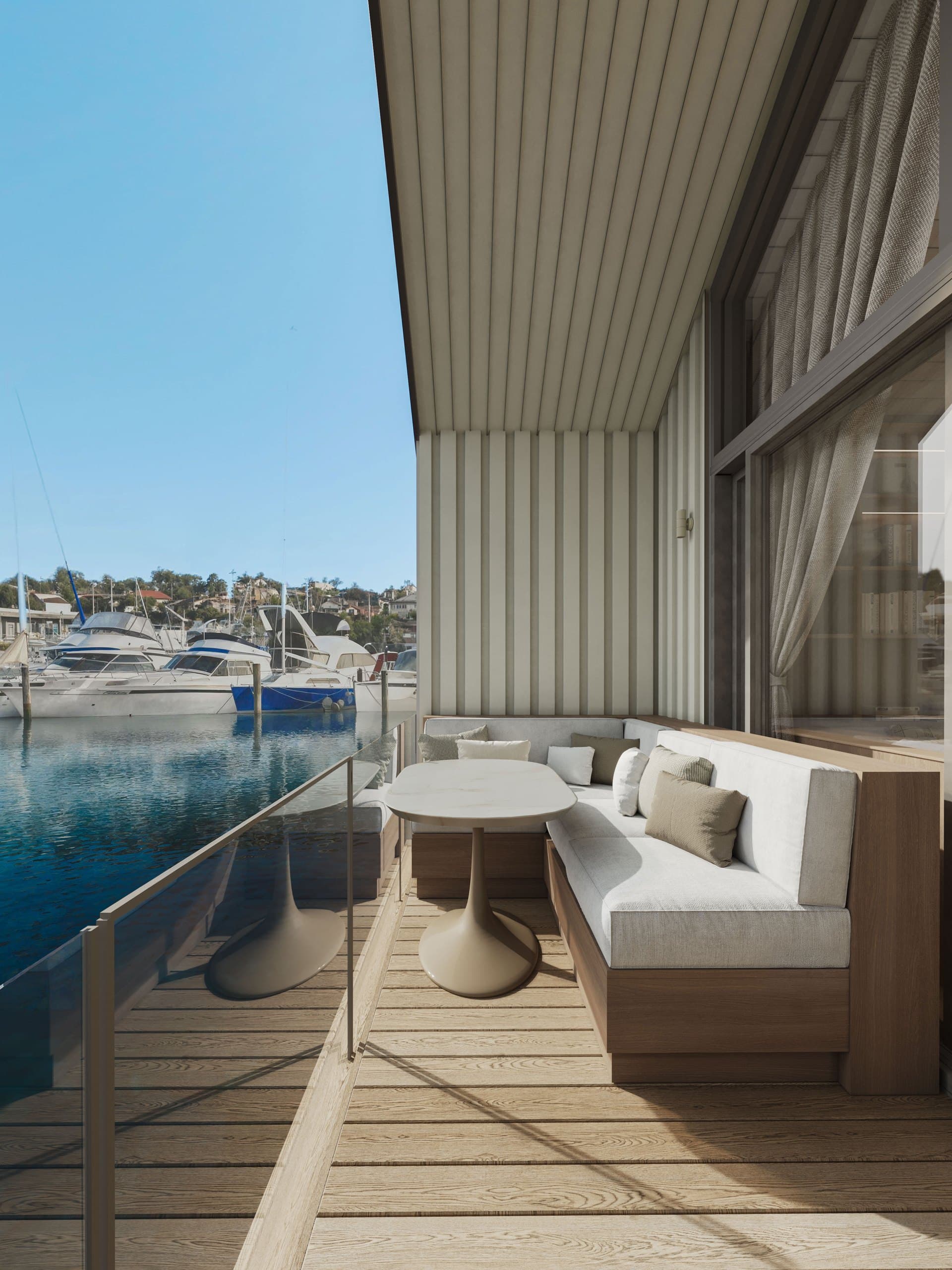 Render of the Boathouse studio deck with outdoor seating looking across the marina