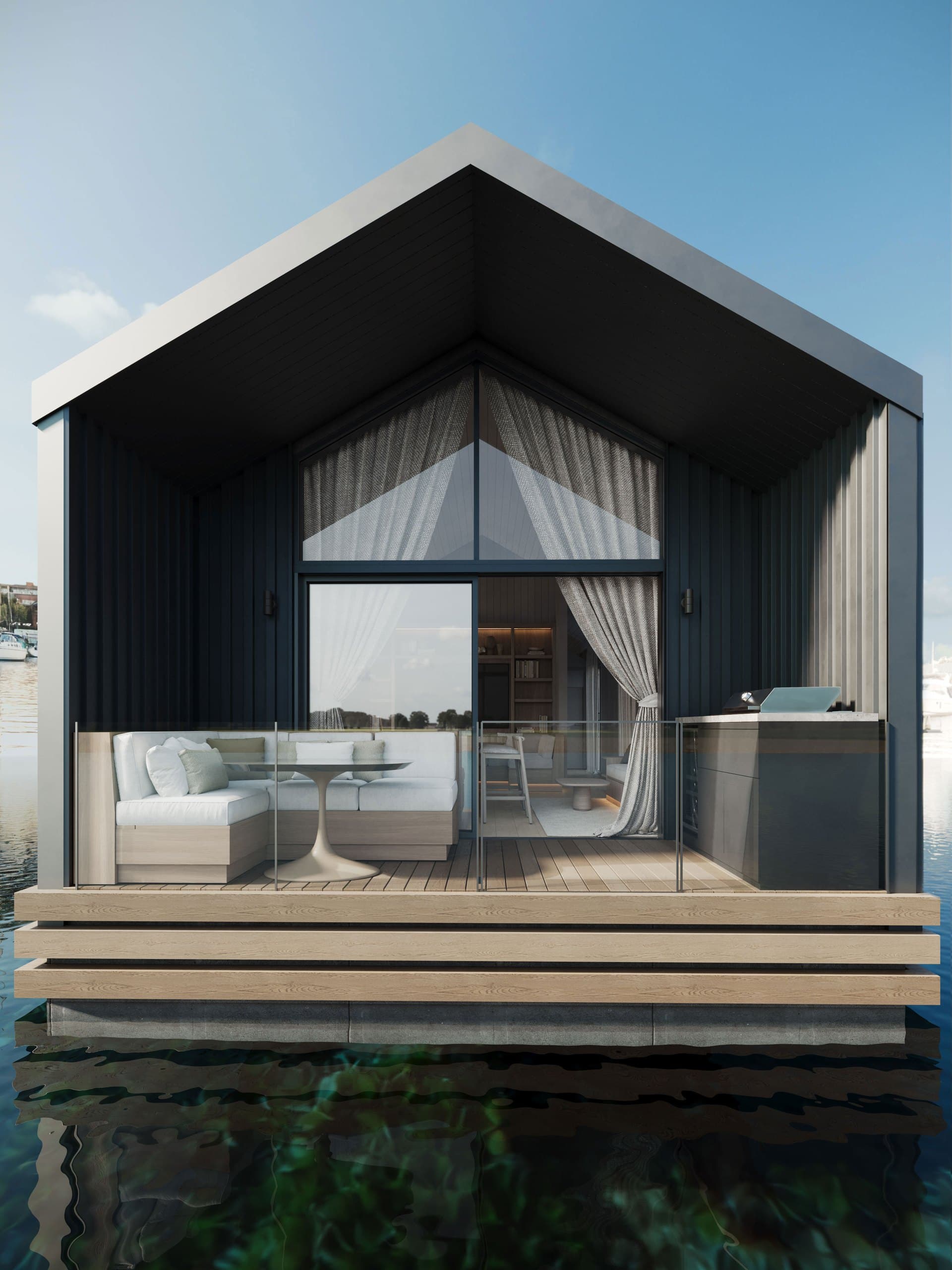 Front render of the two-bedroom Boathouse with its dark gable and waterfront deck