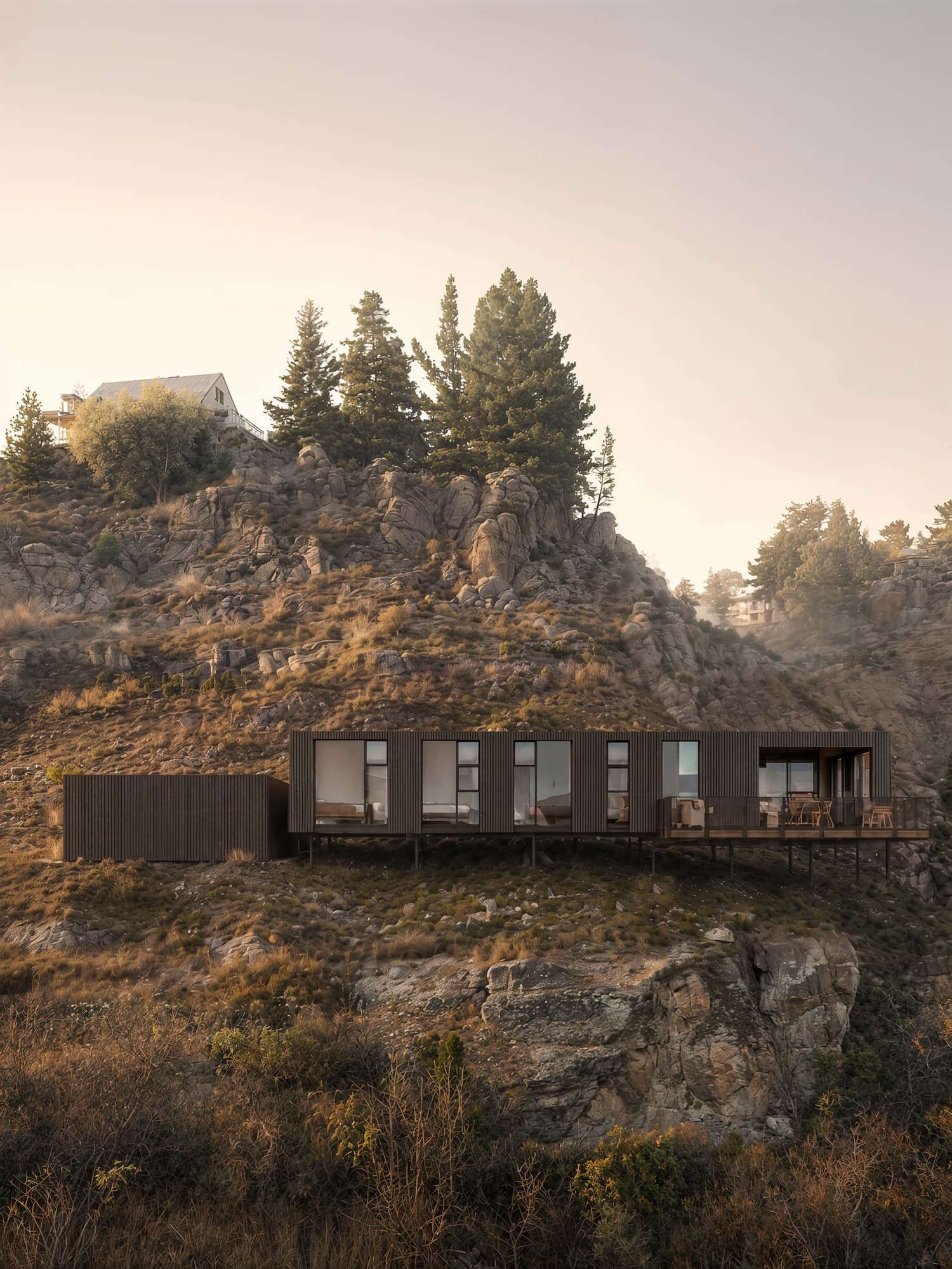 Photorealistic dusk aerial render of the Lanes Road home set into a rock outcrop below a stand of pines at Bridge Hill