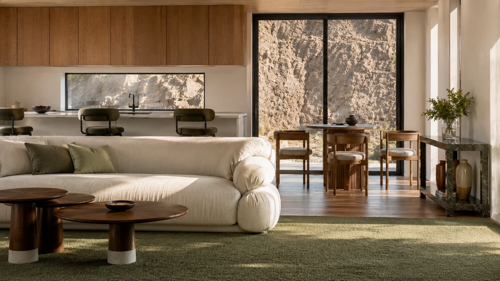 Photorealistic render of the Lanes Road lounge with sage green carpet, dining table and a rear slider facing the rock face