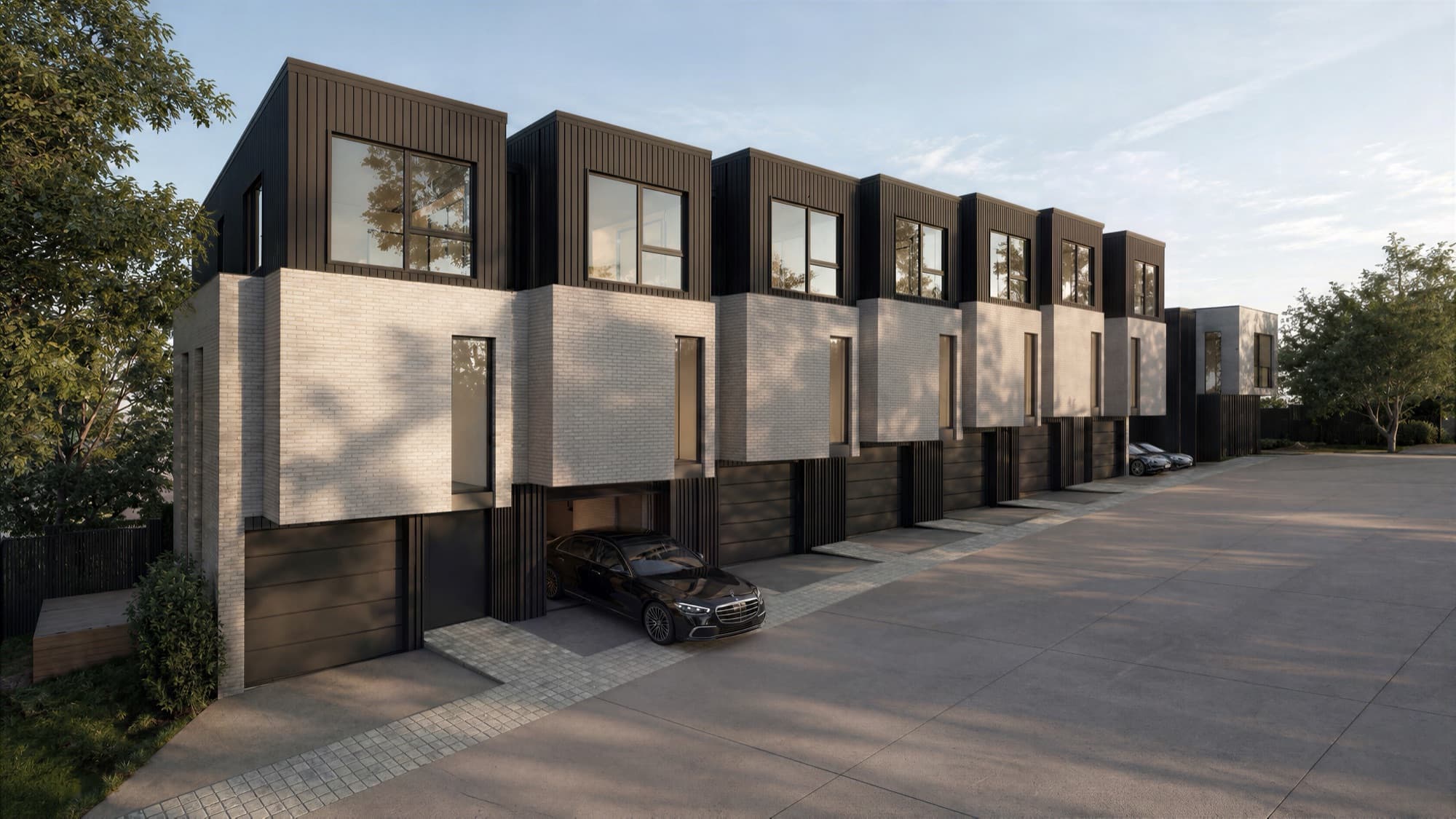 Photorealistic render looking along the Ludlow Terrace driveway past the garages of the townhouse row