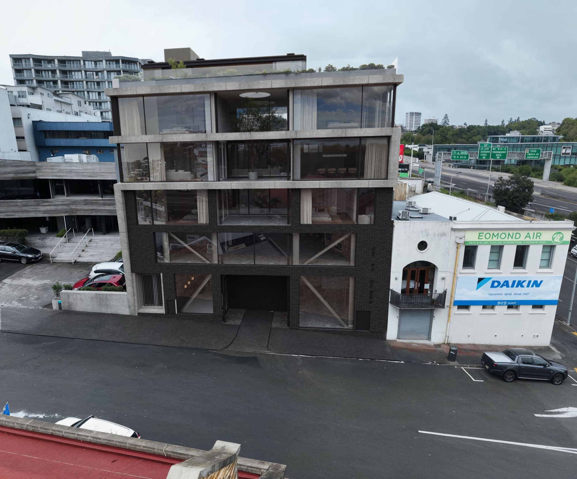 Photorealistic drone render of the Drake Street building composited into its real Freemans Bay streetscape by Render Works
