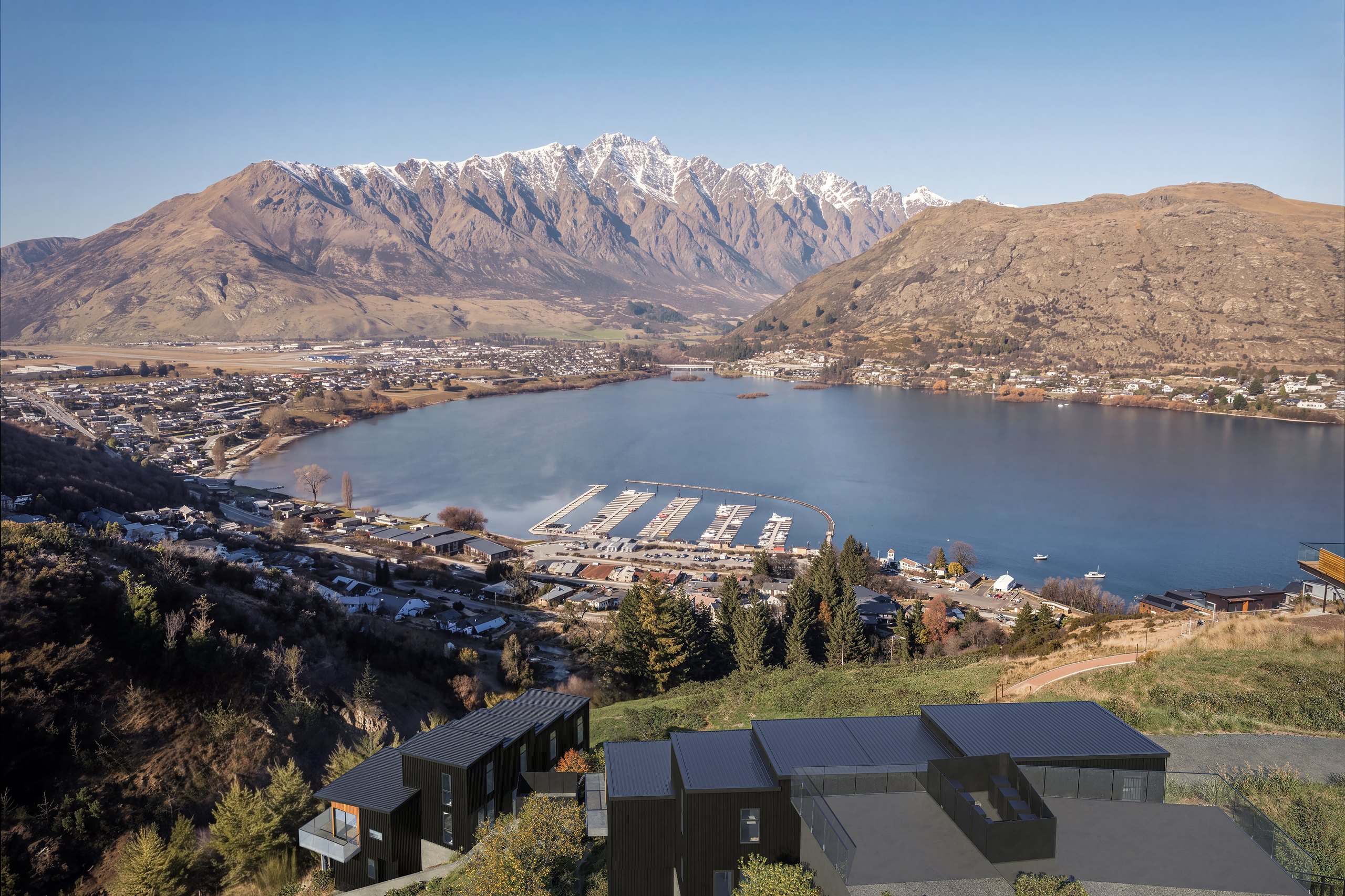Photorealistic aerial render looking over the Middleton homes and Frankton marina to The Remarkables by Render Works