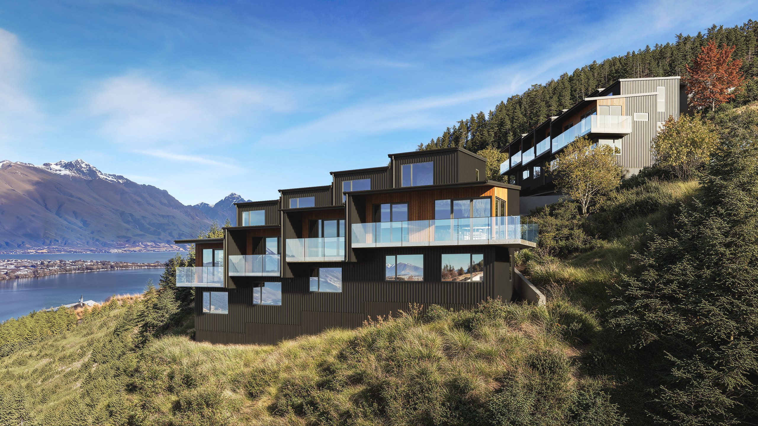 Photorealistic render of a dark-clad three-level Middleton terrace with glass balustrade decks by Render Works